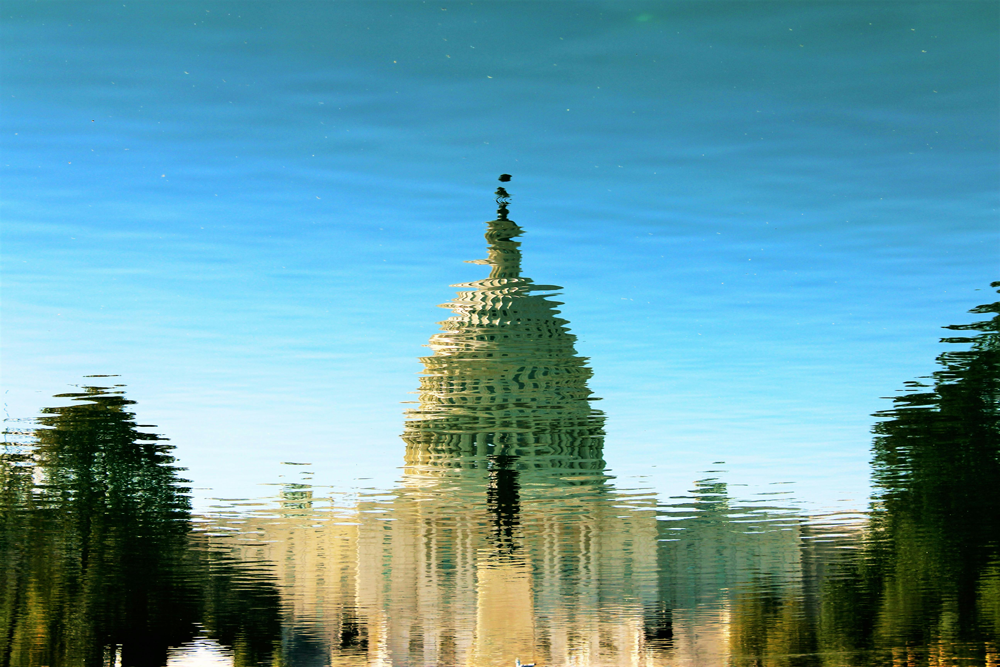 The Capital Building with ripples in the image like it's being view from water.