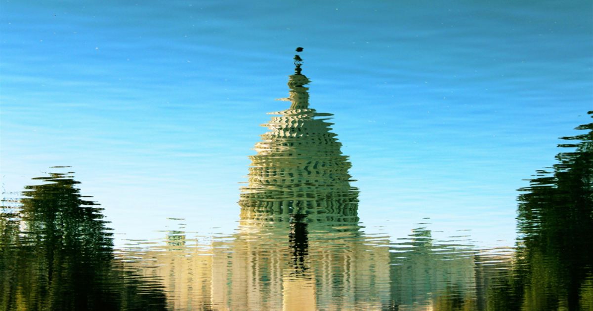 The Capital Building with ripples in the image like it's being view from water.