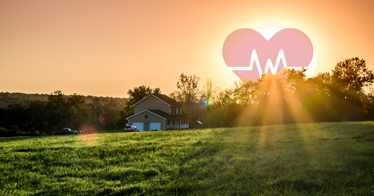 Rural House in the country, sunset with heart in (with pulse) in the sky over the sun